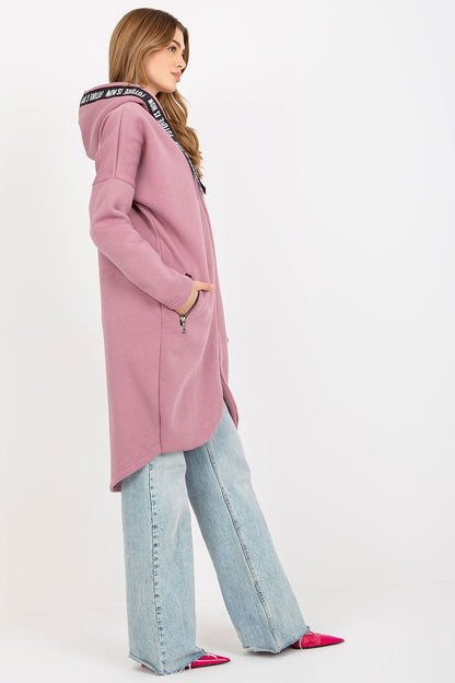 Refined women's zippered sweatshirt in light pink, designed with a comfortable extended cut and trendy logo accents, perfect for layering and a luxurious look.