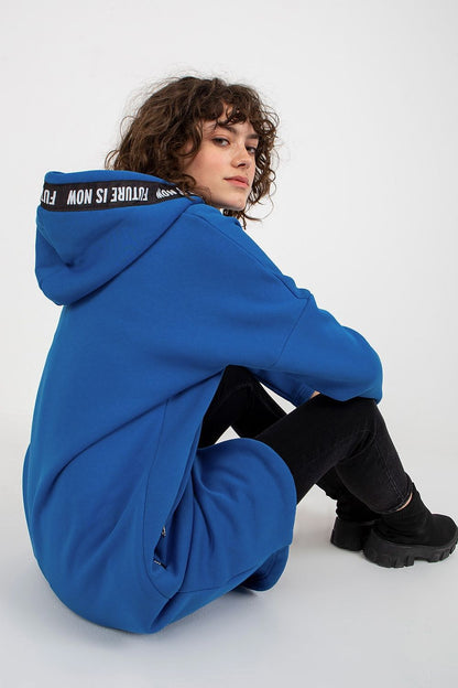 Luxurious women's oversized hooded sweatshirt in vibrant blue, showcasing extended cut and stylish design, perfect for modern fashion.