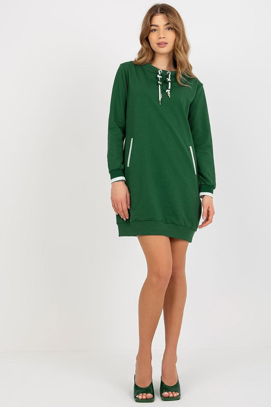Elegant long-sleeve green tracksuit dress with stylish accents, highlighted by a model in high heels, epitomising chic comfort.