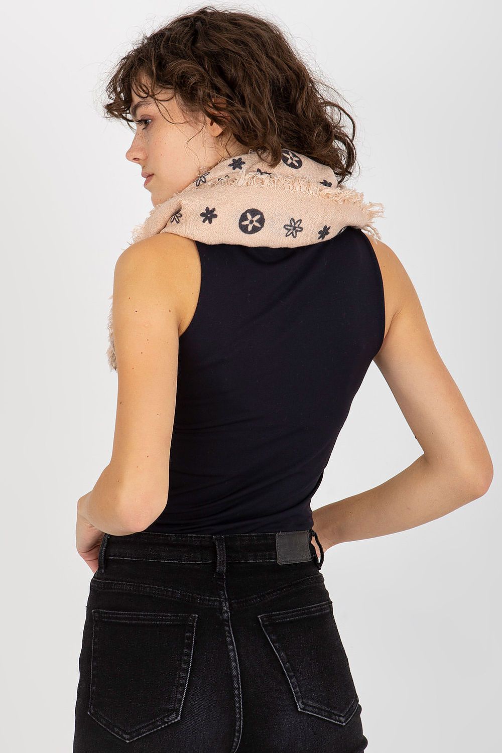 Chic view of a model from behind, highlighting the luxurious neckerchief draped elegantly, revealing its stylish design and texture.