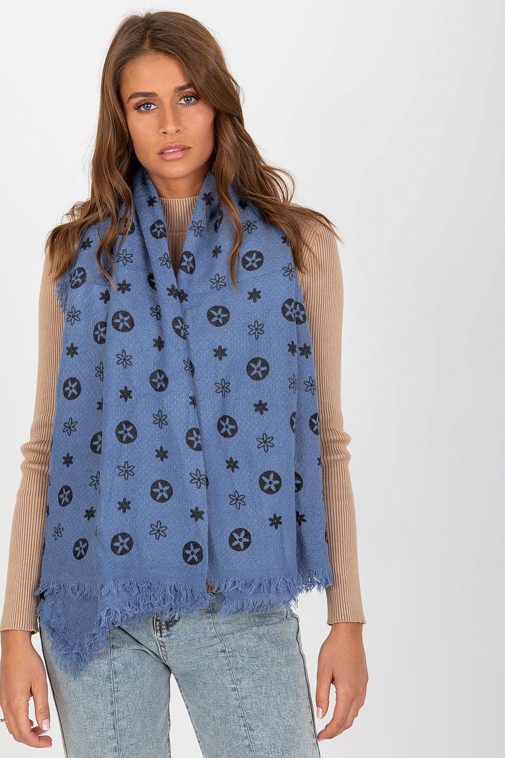 Chic blue neckerchief wrapped around the shoulders, displaying detailed printed patterns, offering a fresh luxury accessory.