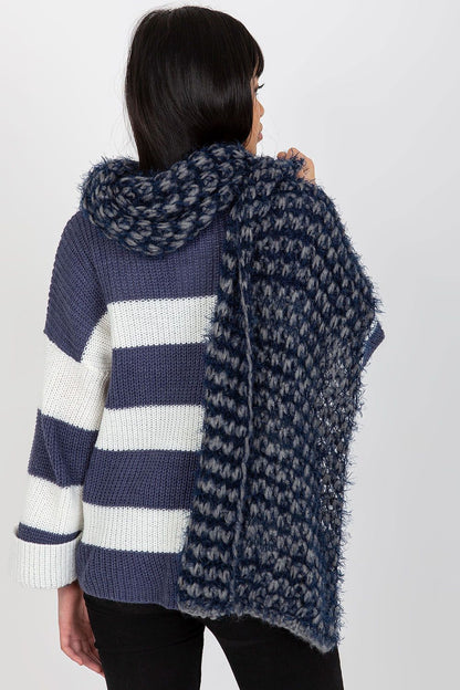 Chic rear view of a model showcasing the voluminous knitted acrylic scarf in navy tones with a stylish knitted sweater.