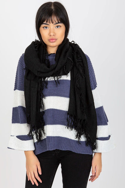 Luxurious black acrylic shawl scarf with elegant tassels, styled on a model wearing a striped sweater, ideal for adding sophistication and warmth to any outfit.