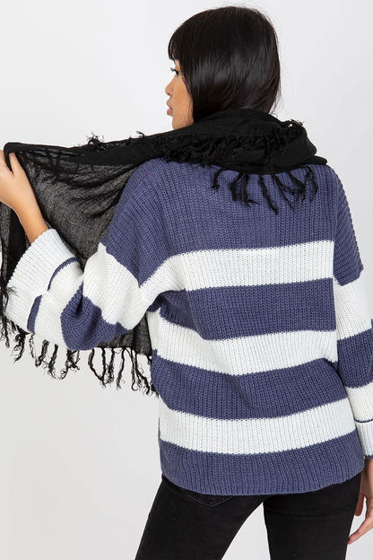 Stylish view of a black acrylic shawl scarf with tassels on a model, highlighting its elegance and comfort, perfect for luxurious layering in cooler seasons.