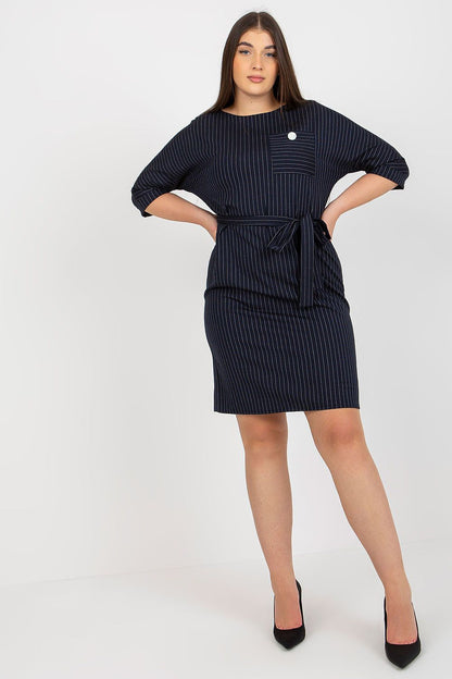 Chic plus size pencil dress in navy stripes, accentuated with a tie belt and 3/4 sleeves, ideal for sophisticated occasions.
