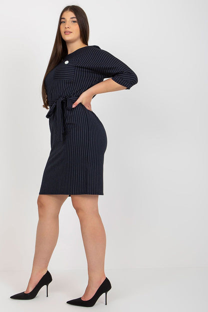 Side view of an exquisite navy striped plus size pencil dress with 3/4 sleeves and a stylish tie belt, perfect for upscale events.