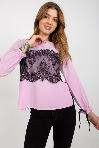 Chic pink cotton blouse adorned with intricate black lace, designed for casual elegance, model highlighting the blouse's stylish features.