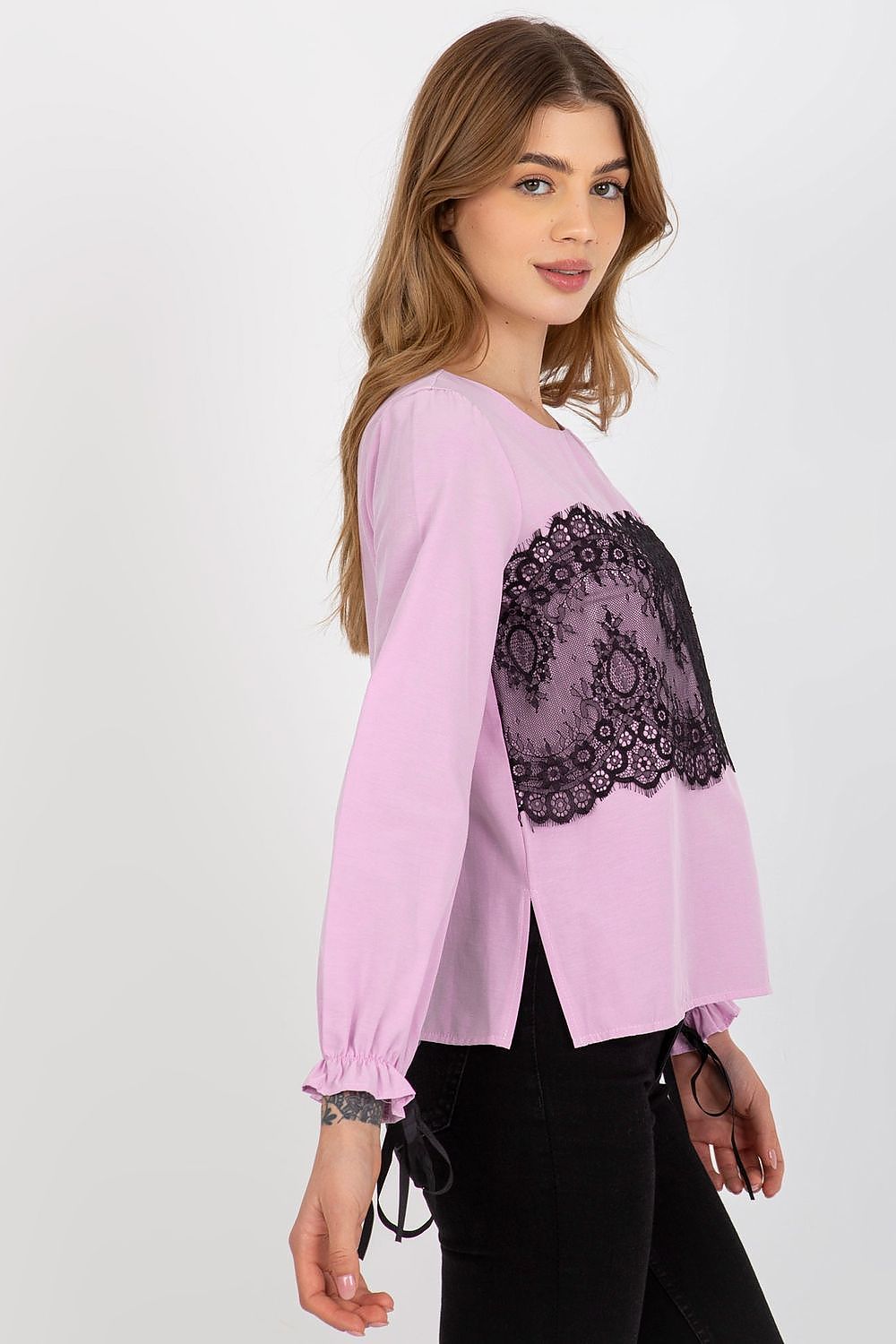 Stylish pink cotton blouse with lace overlay and long sleeves, featuring tied sleeves for a fashionable look, model showcasing the garment.