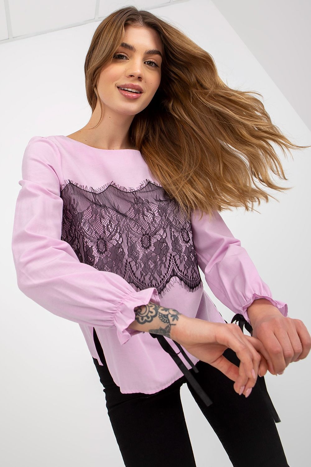 Stylish view of a luxury cotton blouse with long sleeves, showcasing intricate black lace accents, perfect for upscale occasions.