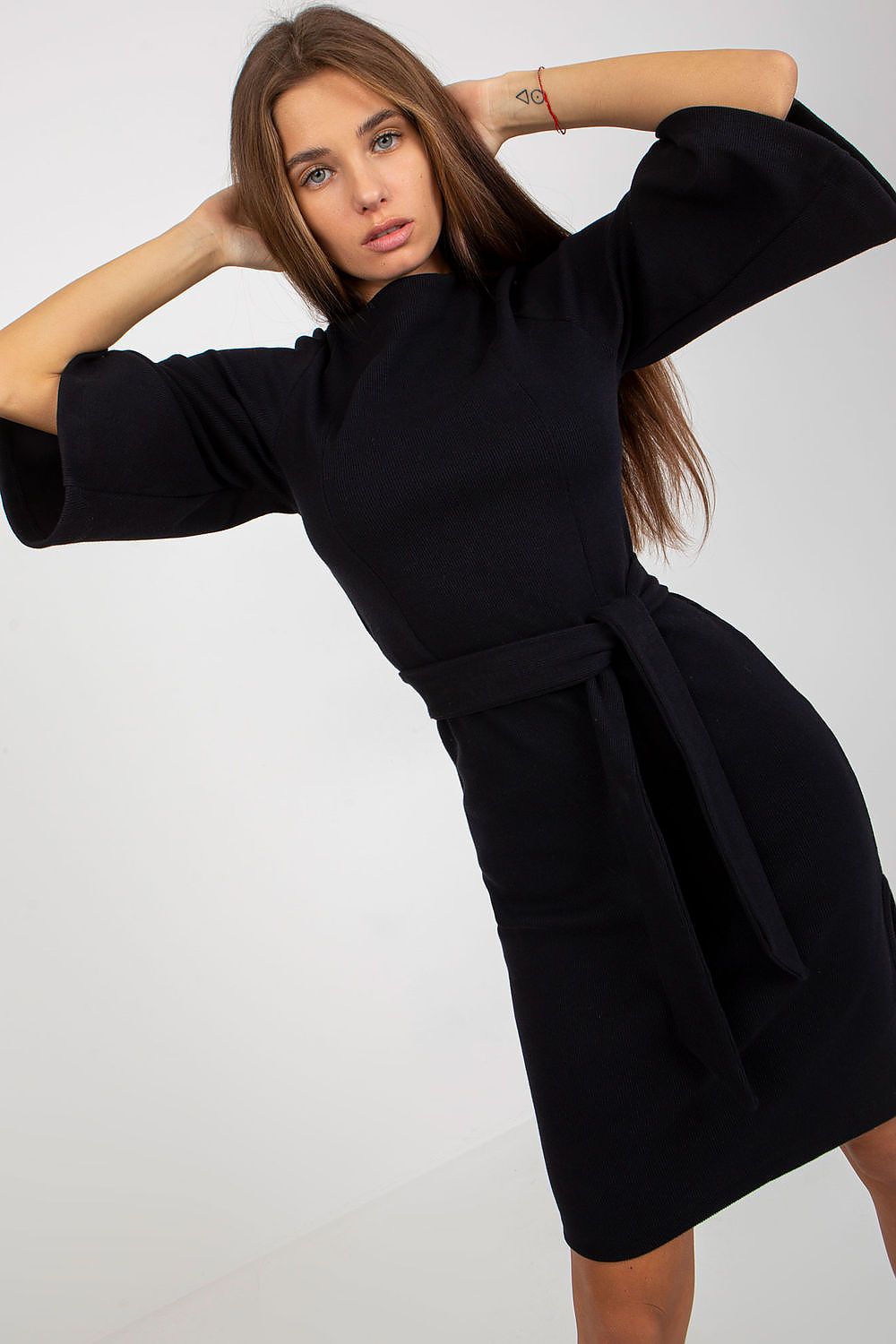 Elegant black pencil dress with 3/4 sleeves and a waist tie, designed in a luxurious ribbed cotton blend, exuding sophistication and style.