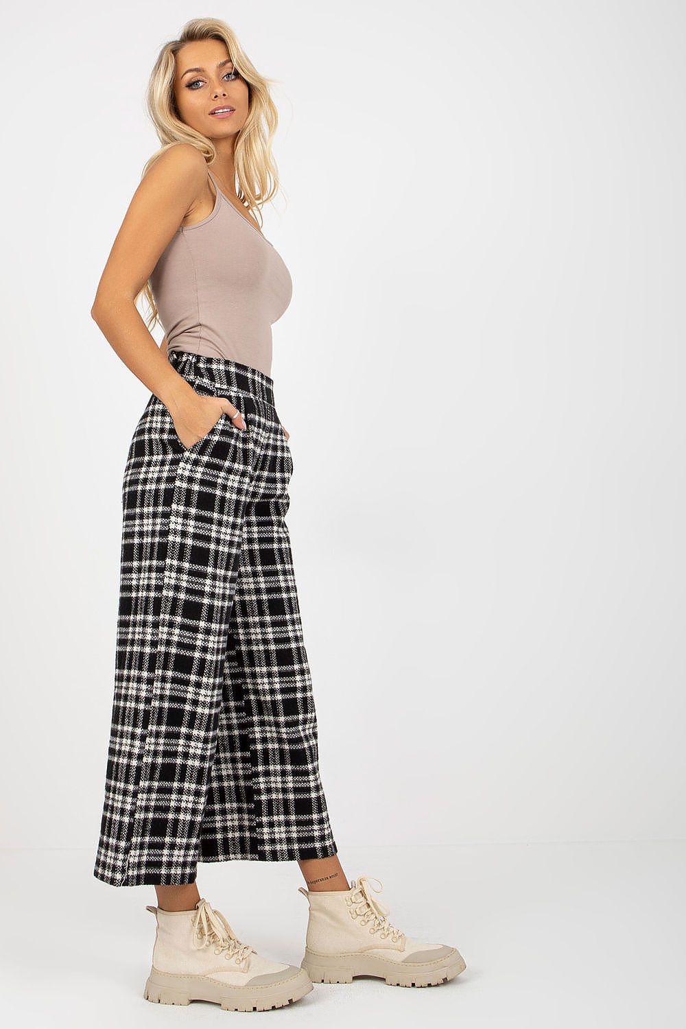Side profile of Lakerta women's elegant checkered wool trousers, designed with functional slip pockets and a comfortable fit, ideal for both casual and formal occasions.