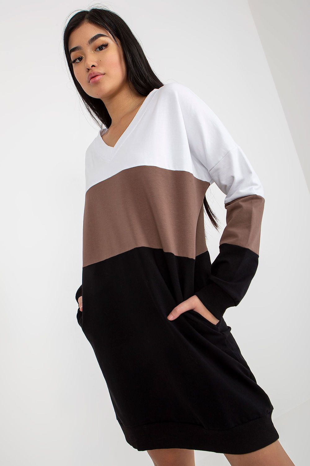 Elegant Rue Paris tracksuit dress featuring a heart neckline, long sleeves, and side pockets. Styled in a sophisticated colourblock design with white, brown, and black hues, perfect for chic everyday wear.