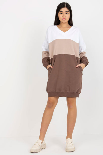 Striking front view of a Rue Paris tracksuit dress, elegantly presented with long sleeves and a sophisticated v-neckline. The dress features a refined colour palette, ideal for versatile, upscale everyday fashion.