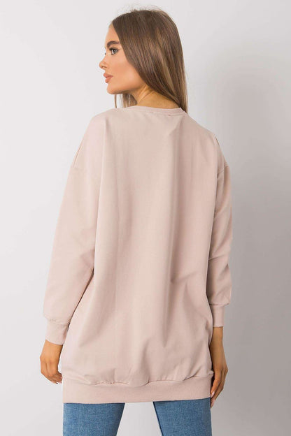 Back view of an exquisite long-sleeve tunic by Rue Paris, highlighted in soft fabric with a minimalist design, perfect for a stylish yet comfortable look.