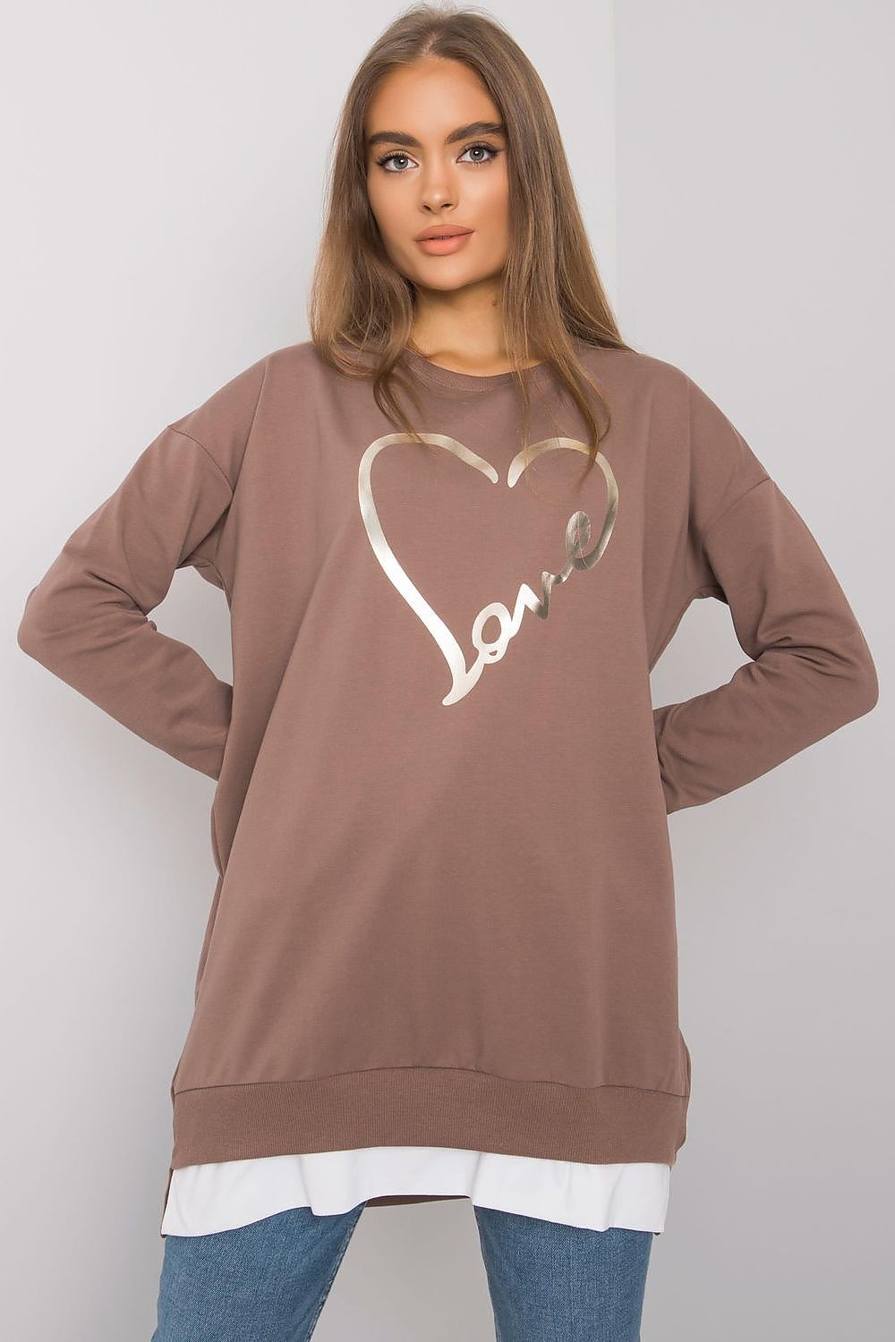 Sophisticated loose-fitting brown tunic with a metallic 'love' heart design, accentuated with stylish layering over denim for a contemporary luxury look.
