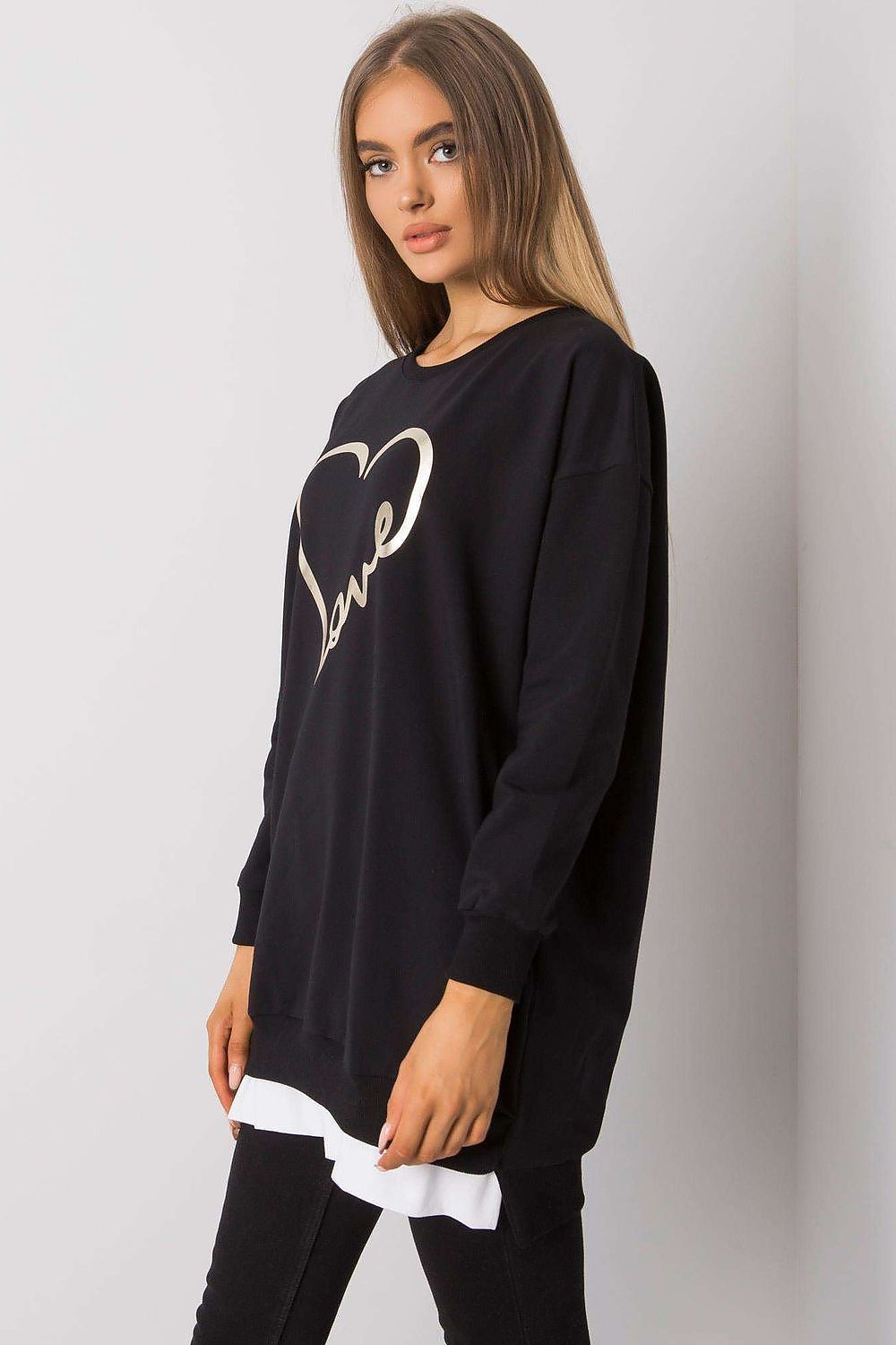 Chic side view of the elegant loose-fitting tunic by Rue Paris showcasing the stylish long sleeves and luxurious feel, adorned with a striking gold 'Love' print.