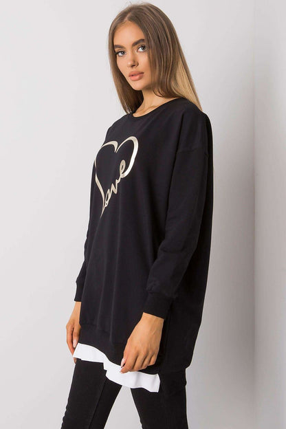 Chic side view of the elegant loose-fitting tunic by Rue Paris showcasing the stylish long sleeves and luxurious feel, adorned with a striking gold 'Love' print.