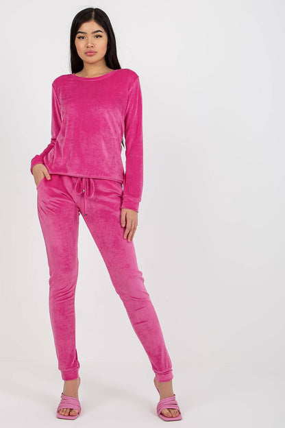 Luxurious pink velour blouse and pants set by Rue Paris, featuring tie waist and pockets, model displaying the outfit front view.
