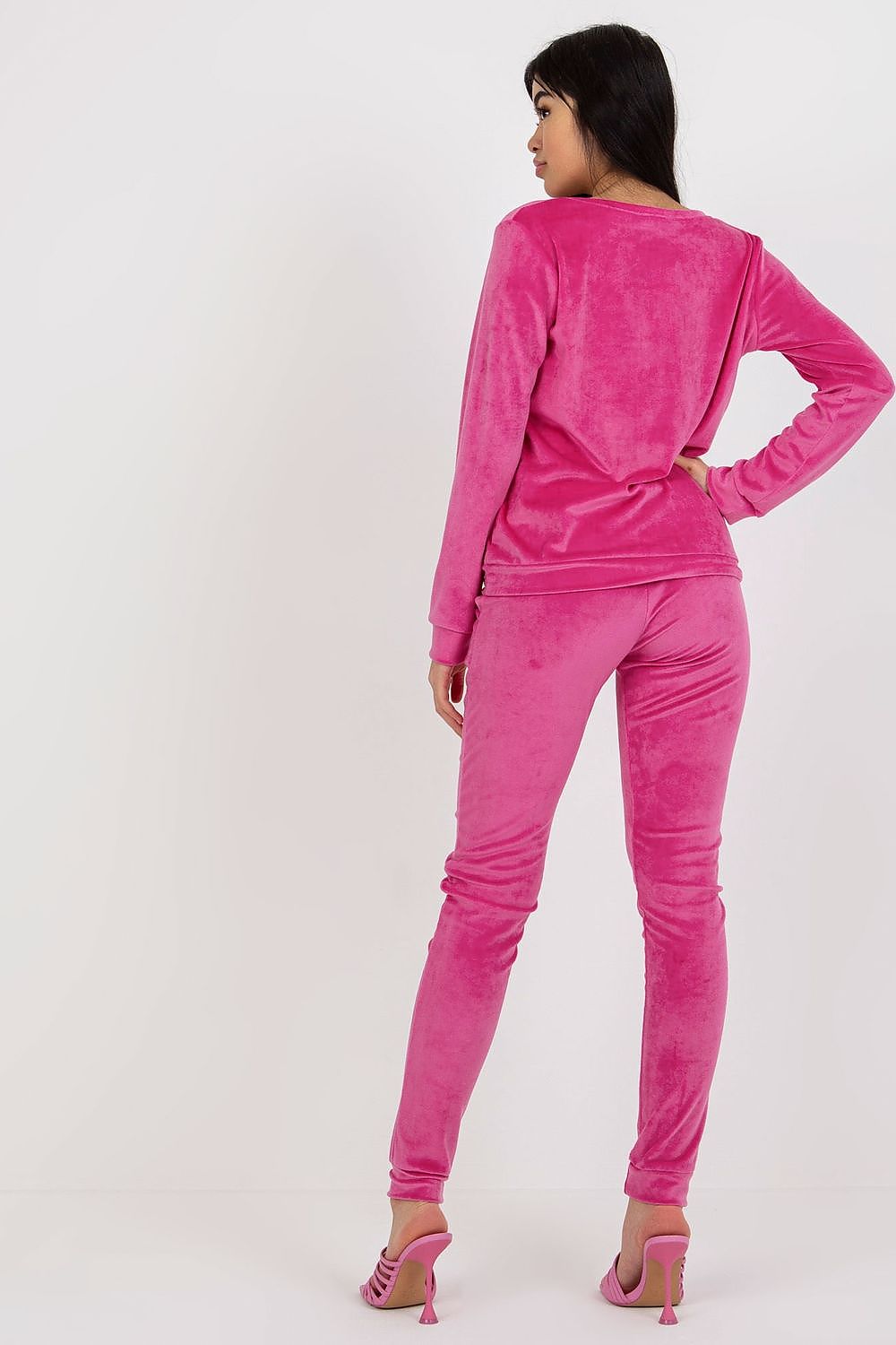 Back view of a chic pink velour blouse and pants set by Rue Paris, highlighting the luxurious fabric and design.