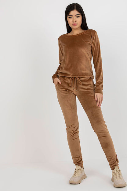 Luxurious velour blouse and pants set by Rue Paris in rich brown, featuring a relaxed fit, long sleeves, and elegant tie waist detail, styled with casual footwear.