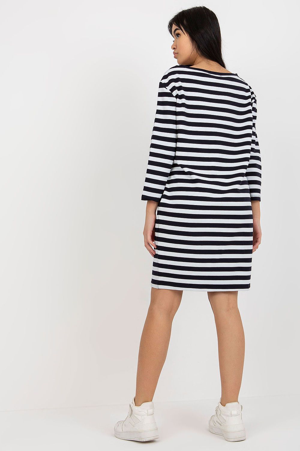 Stylish back view of a black and white striped cotton dress by Rue Paris, featuring elegant long sleeves and casual chic style.