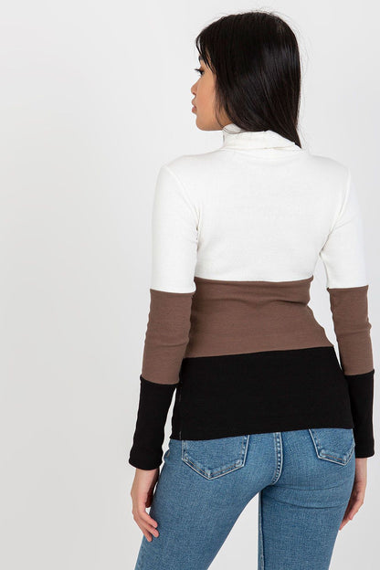 Elegant ribbed turtleneck sweater in cream, brown, and black on model, showcasing a stylish back view.