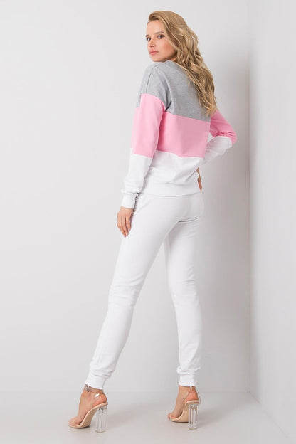 Sophisticated rear view of a model sporting a luxury 2-piece cotton sweatshirt and joggers by Rue Paris, featuring a stylish grey and pink colour-block look.