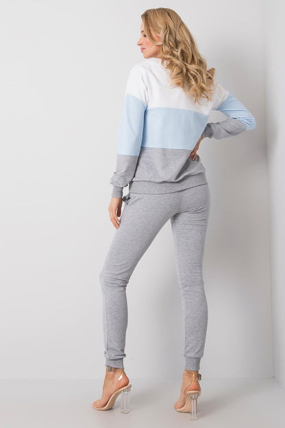 Elegant luxury 2-piece set featuring a stylish cotton sweatshirt with a colour-block design and matching jogger pants. Model showcases ensemble with a focus on comfort and sophistication, set against a neutral backdrop.