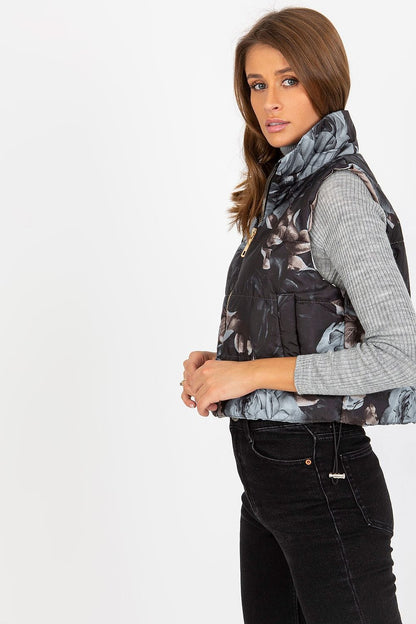 Side profile of a floral quilted insulated vest, highlighting the elegant fabric and stylish silhouette.