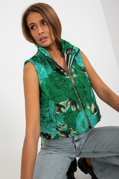 Vibrant green floral quilted insulated vest, exuding luxury and trendy elegance, worn casually in a seated pose.