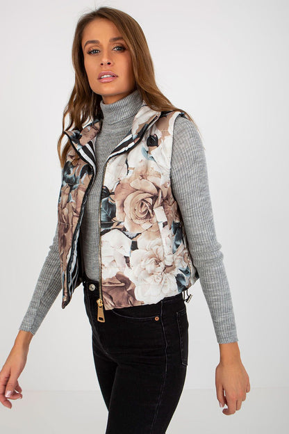 Chic floral quilted vest in muted colours, elegantly styled with a turtleneck for an elevated autumn fashion statement.
