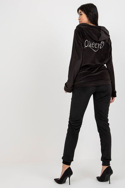 Sophisticated black velour tracksuit with an embroidered 'Queen' design, featuring a trendy hoodie and tailored pants, ideal for women seeking luxury and comfort in their casual wardrobe.