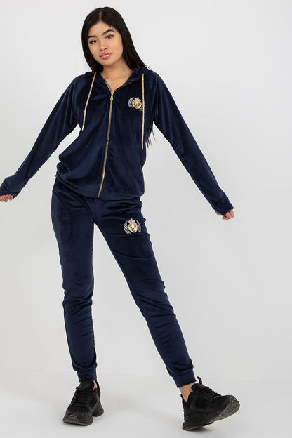 Luxurious navy velour sweatshirt and trousers set, highlighted by elegant embroidery, posed in a graceful manner to accentuate the ensemble.