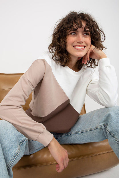 Chic women's long sleeve cotton blend sweatshirt in a fashionable geometric pattern, styled in cream and shades of brown, with a relaxed fit.