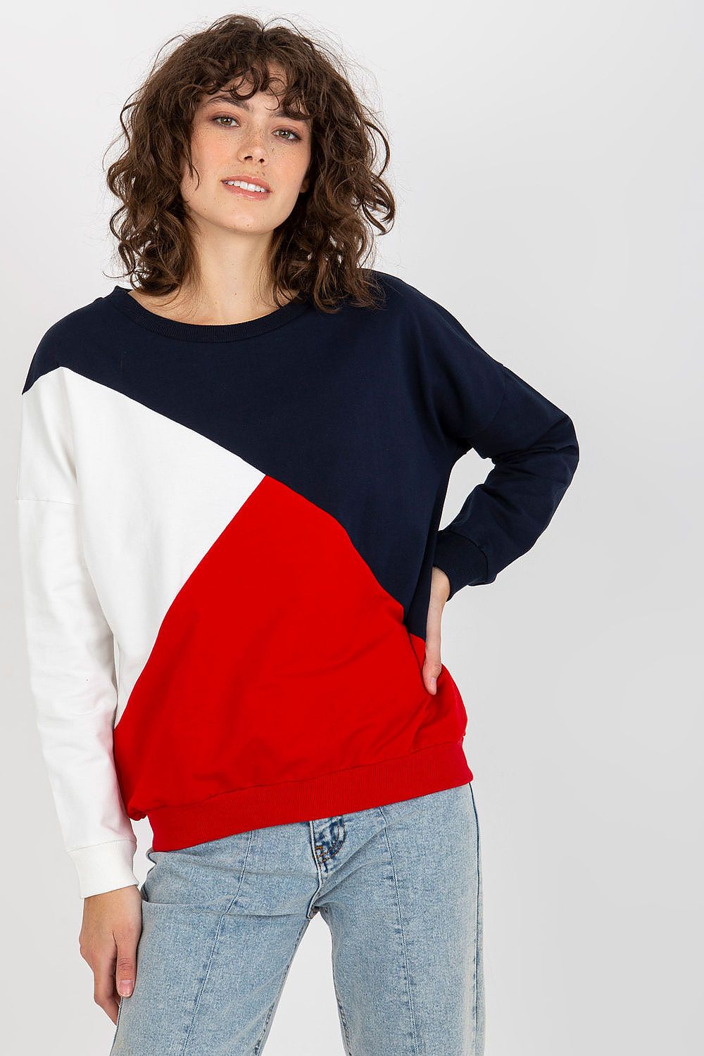 Sophisticated women's luxury sweatshirt with long sleeves, featuring a striking tri-colour design of navy blue, red, and white, worn casually.