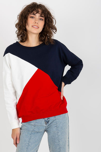 Sophisticated women's luxury sweatshirt with long sleeves, featuring a striking tri-colour design of navy blue, red, and white, worn casually.