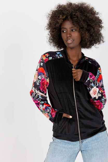 Luxurious Velour Bomber Jacket by Rue Paris, showcasing a vibrant floral design and elegant zipper closure, perfect for stylish winter wear.