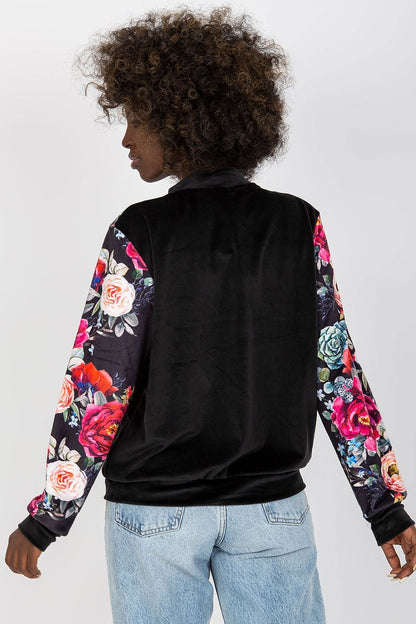 Back view of the Luxurious Velour Bomber Jacket by Rue Paris, highlighted by its exquisite velour fabric and trendy zipper closure for fashionable comfort.
