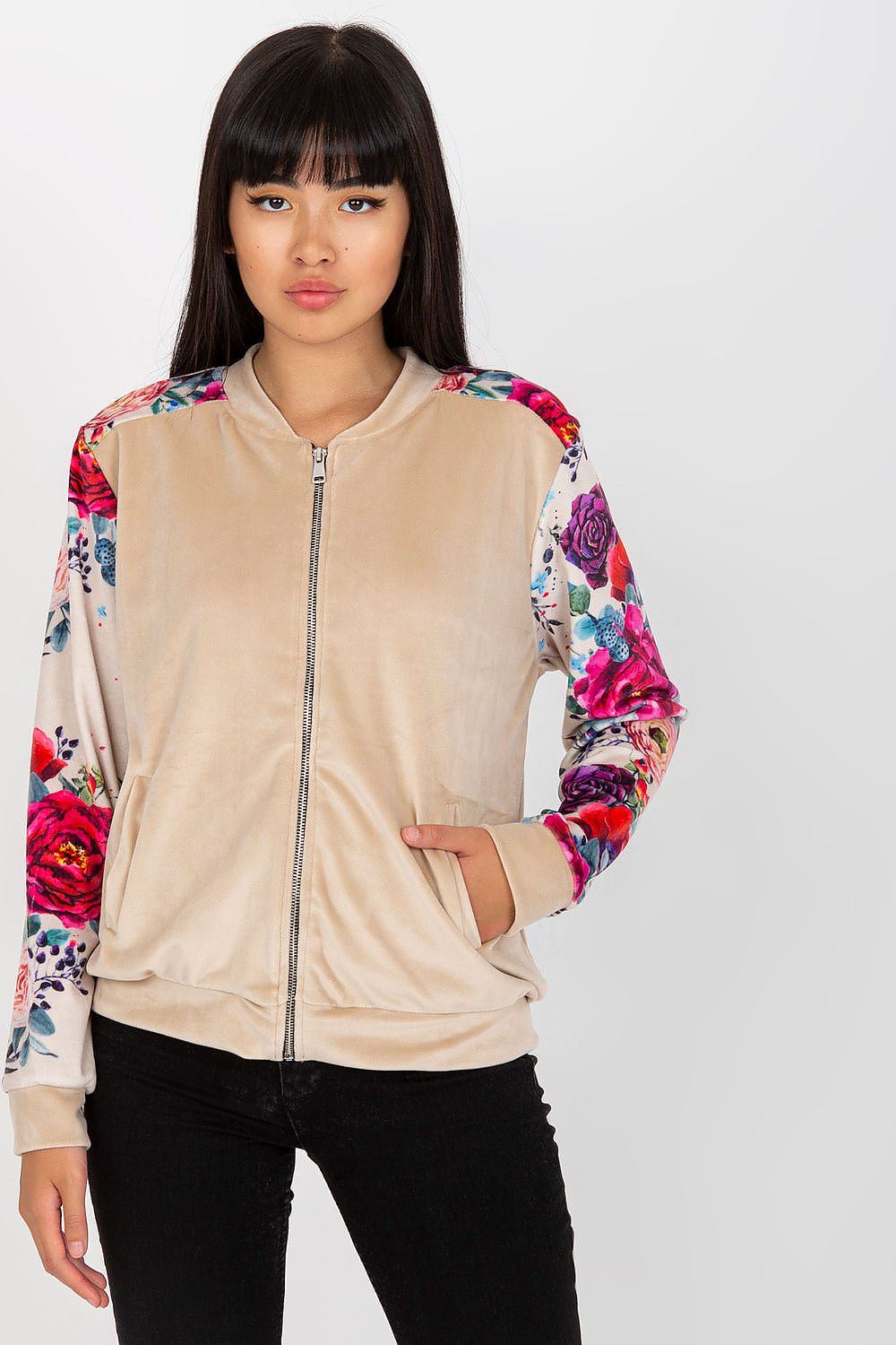 Model wearing the Luxurious Velour Bomber Jacket by Rue Paris, demonstrating its stylish silhouette and beautiful floral design, perfect for elevating any outfit.