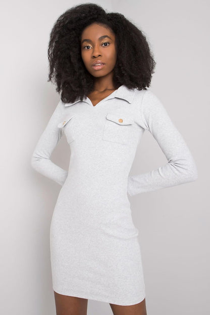 Model wearing the Elegant Ribbed Pencil Cut Dress with Heart Neckline and Long Sleeves by Rue Paris, demonstrating the chic fit and stylish appeal perfect for any formal occasion.