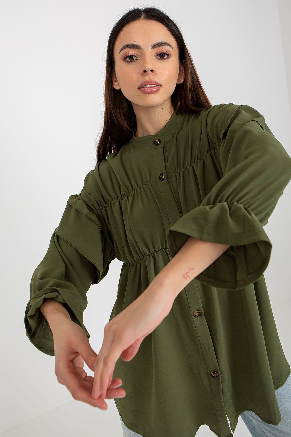 Model wearing the Luxurious Loose Cut Long Sleeve Button-Down Shirt with Ruffles by Och Bella, illustrating versatility and chic fashion appeal.
