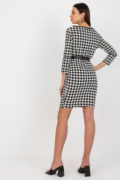 Close-up of Och Bella Long Sleeve Pencil Cut Dress showcasing its elegant belt and functional pockets, perfect for a refined day look.