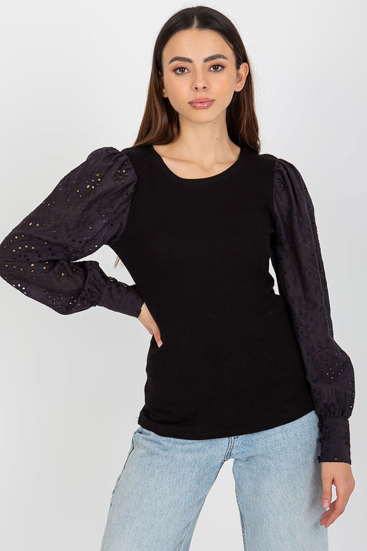 Och Bella Elegant Cotton Blouse with Openwork Long Sleeves and Round Neckline elegantly displayed against a luxurious backdrop.