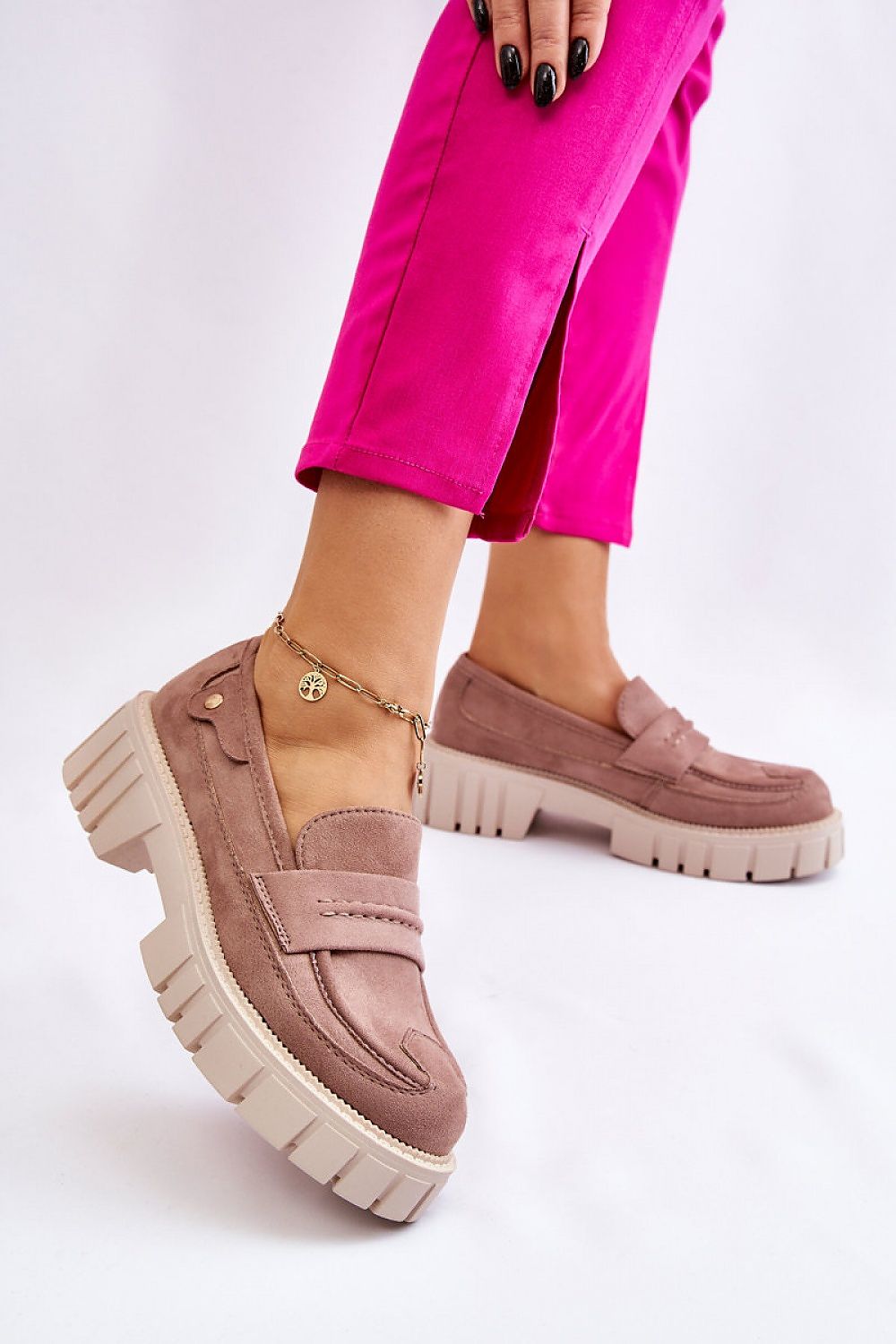 Chic eco leather loafer half shoes featuring a trendy platform and rivet detailing, worn with vibrant pink pants, designed by Step in Style.