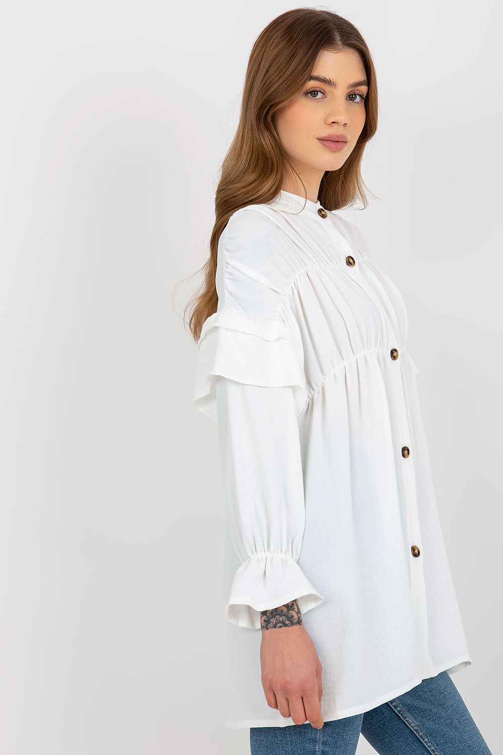 Close-up view of the Luxurious Loose Cut Long Sleeve Button-Down Shirt with Ruffles by Och Bella, highlighting the fine texture and luxurious polyester material.