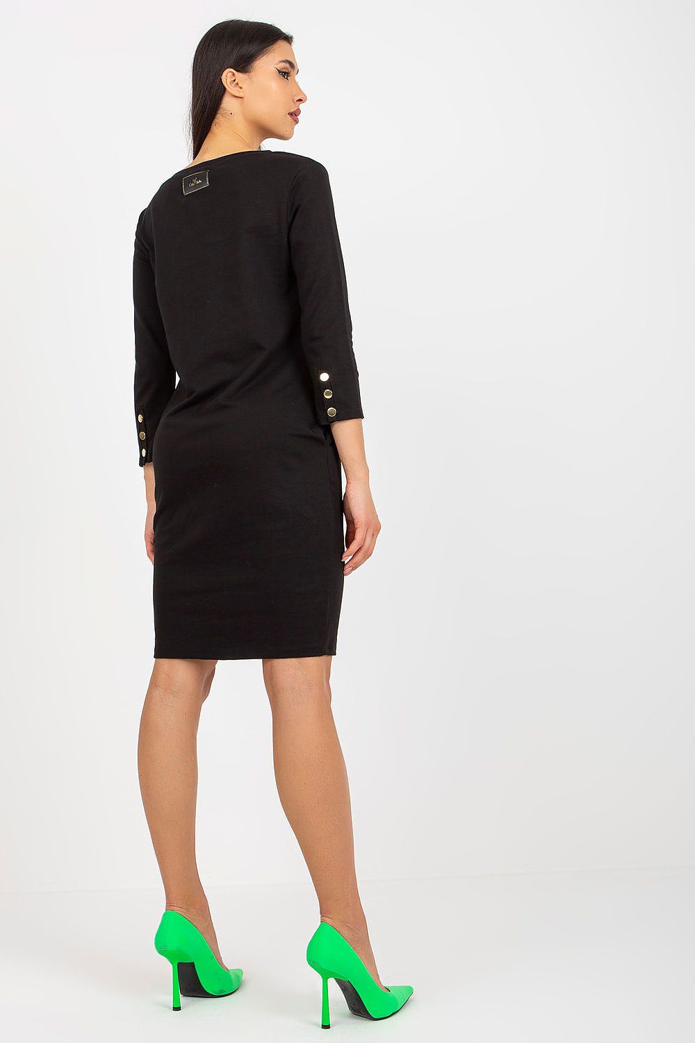 Flat lay of the Och Bella 3/4 Sleeve Tracksuit Dress with Side Pockets and Decorative Buttons, accentuating its luxurious fabric and design.