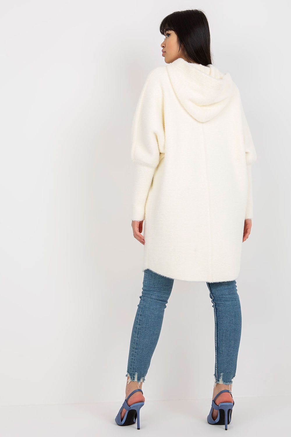 Model showcasing the Luxury Women's Coat MBM with Hood, highlighting its stylish long sleeves and versatile zippered design in a beautiful outdoor setting.