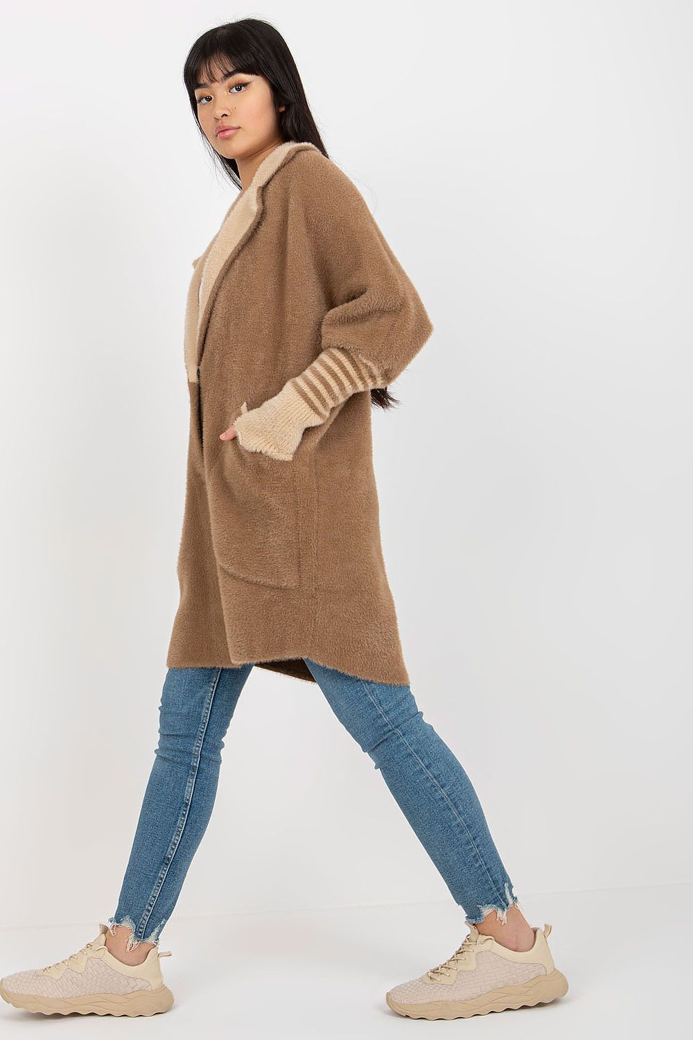 Fashionable presentation of the Luxurious Women's Long Sleeve Wool Blend Coat with Large Pockets and Press Stud Fastening styled with accessories against a chic backdrop.