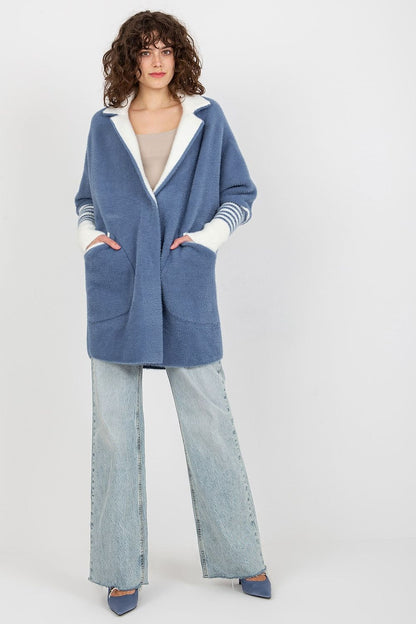 Model wearing the Luxurious Women's Long Sleeve Wool Blend Coat with Large Pockets and Press Stud Fastening in a fashionable outdoor setting.