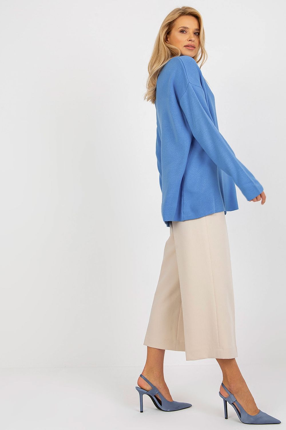 Model wearing Luxurious Rue Paris Loose Cut Sweater with Heart Neckline and Long Sleeves, styled for a chic everyday look.